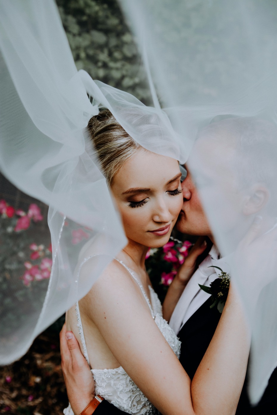 sweet bride and groom veil photo