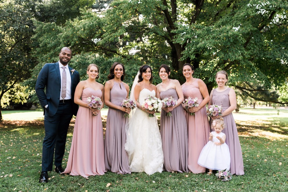 soft pink and purple bridesmaid dresses and bridesman in purple tie