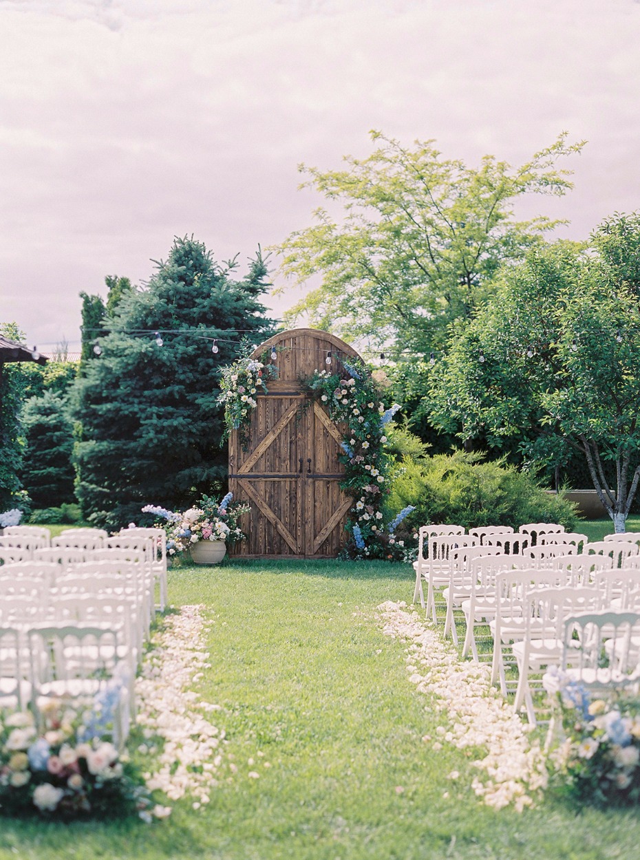 summer time wedding ceremony outside in a beautiful garden
