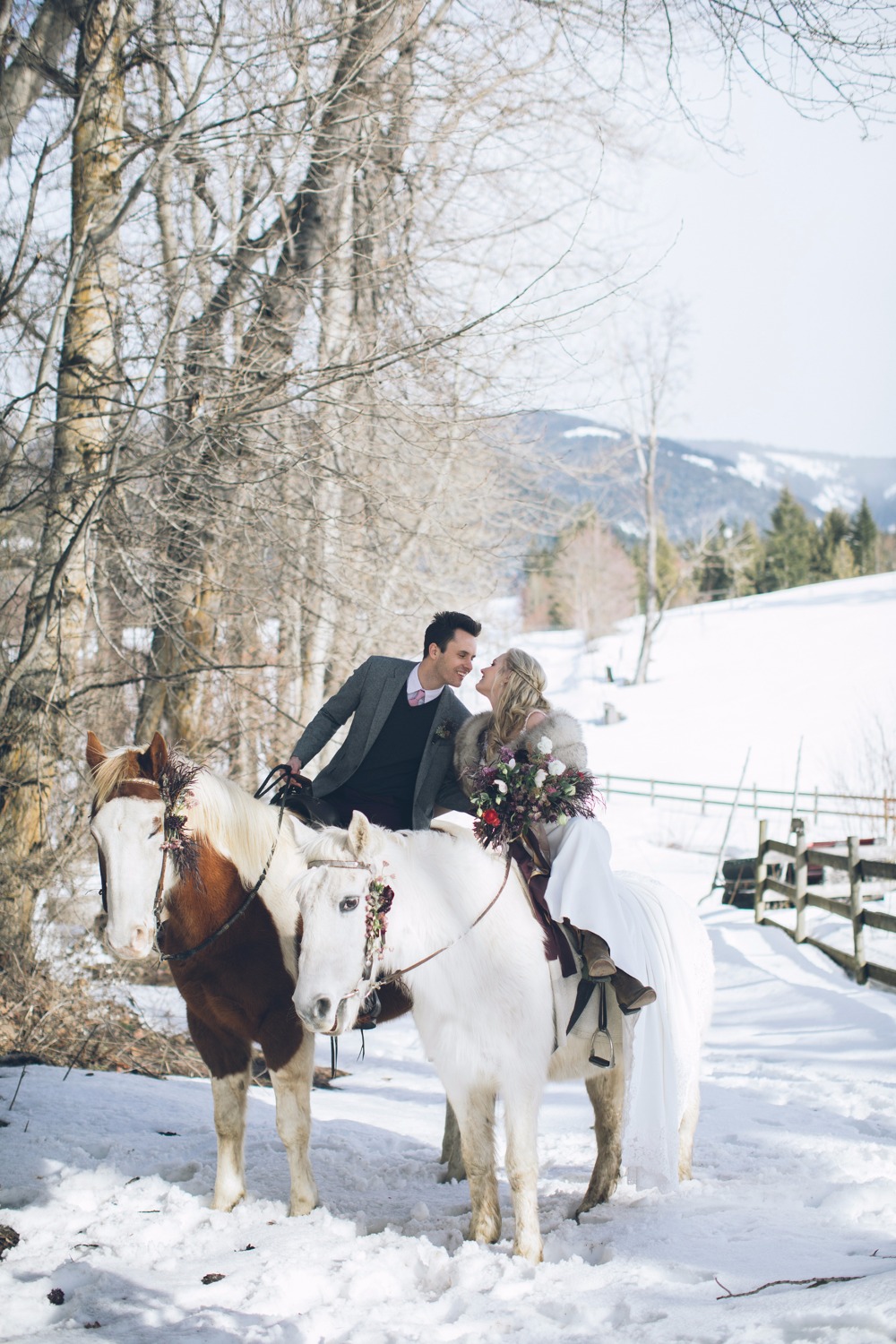 bride and groom on wedding horses