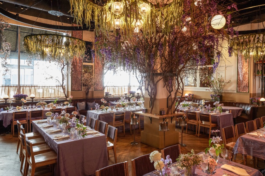 Elegant restaurant wedding reception with floral decor