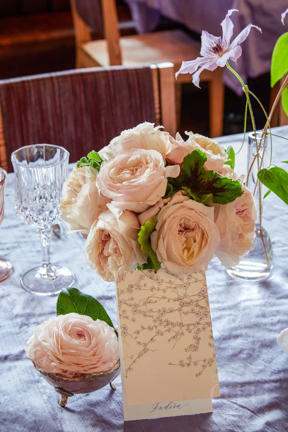 Elegant blush rose bouquet centerpiece with table card