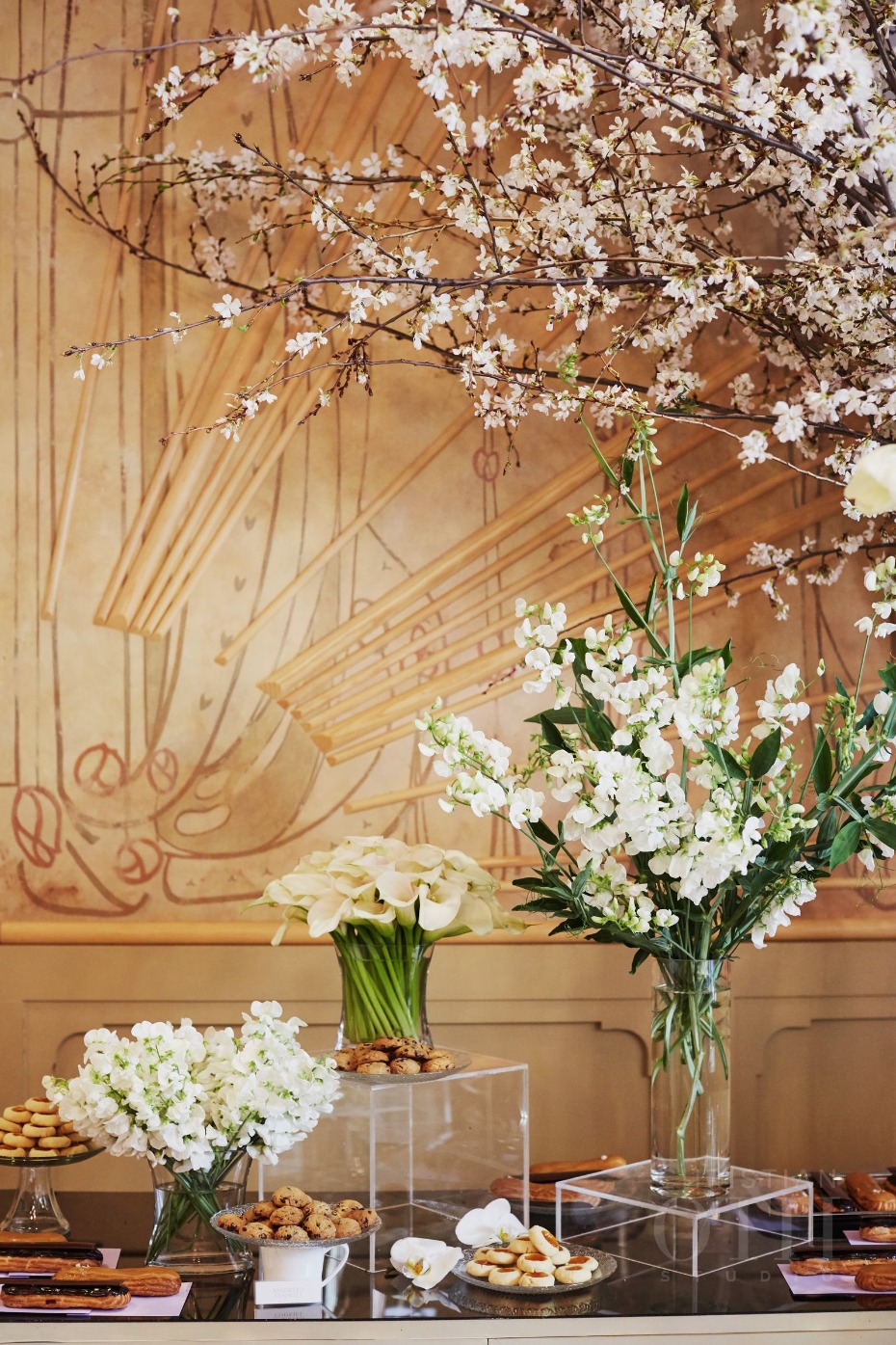 Elegant floral display with cookies on a buffet table setting