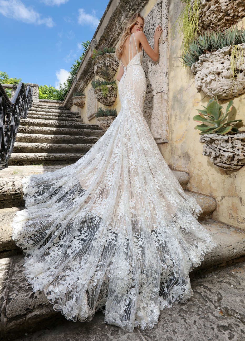 Stunning lace mermaid wedding dress on stone steps
