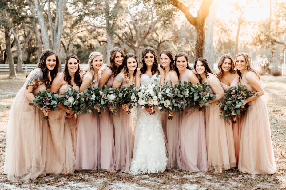 Soft bridesmaid dresses in blush and peach