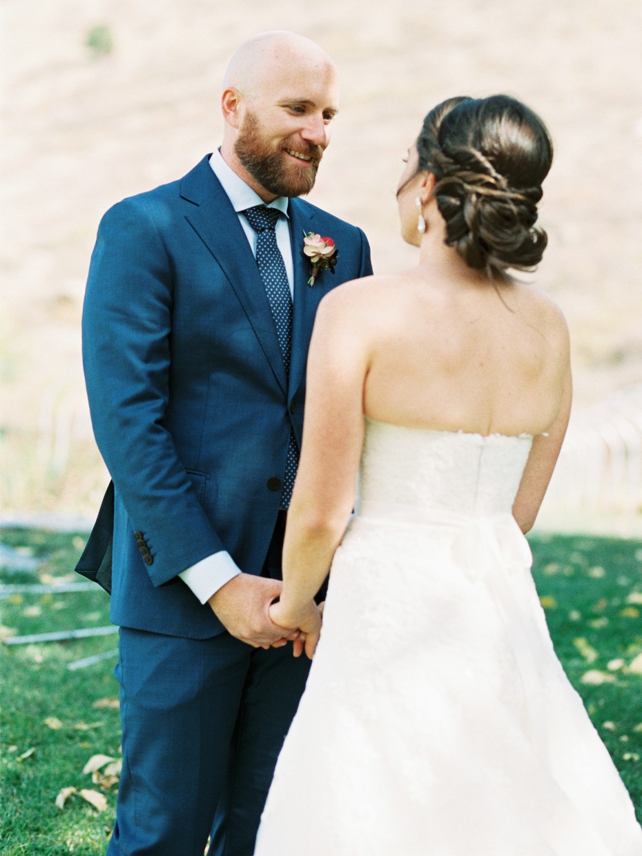 groom and his bride first look