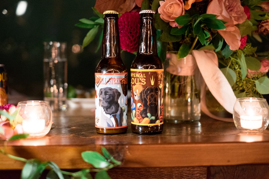homemade wedding beer with custom labels depicting the bride and grooms dogs