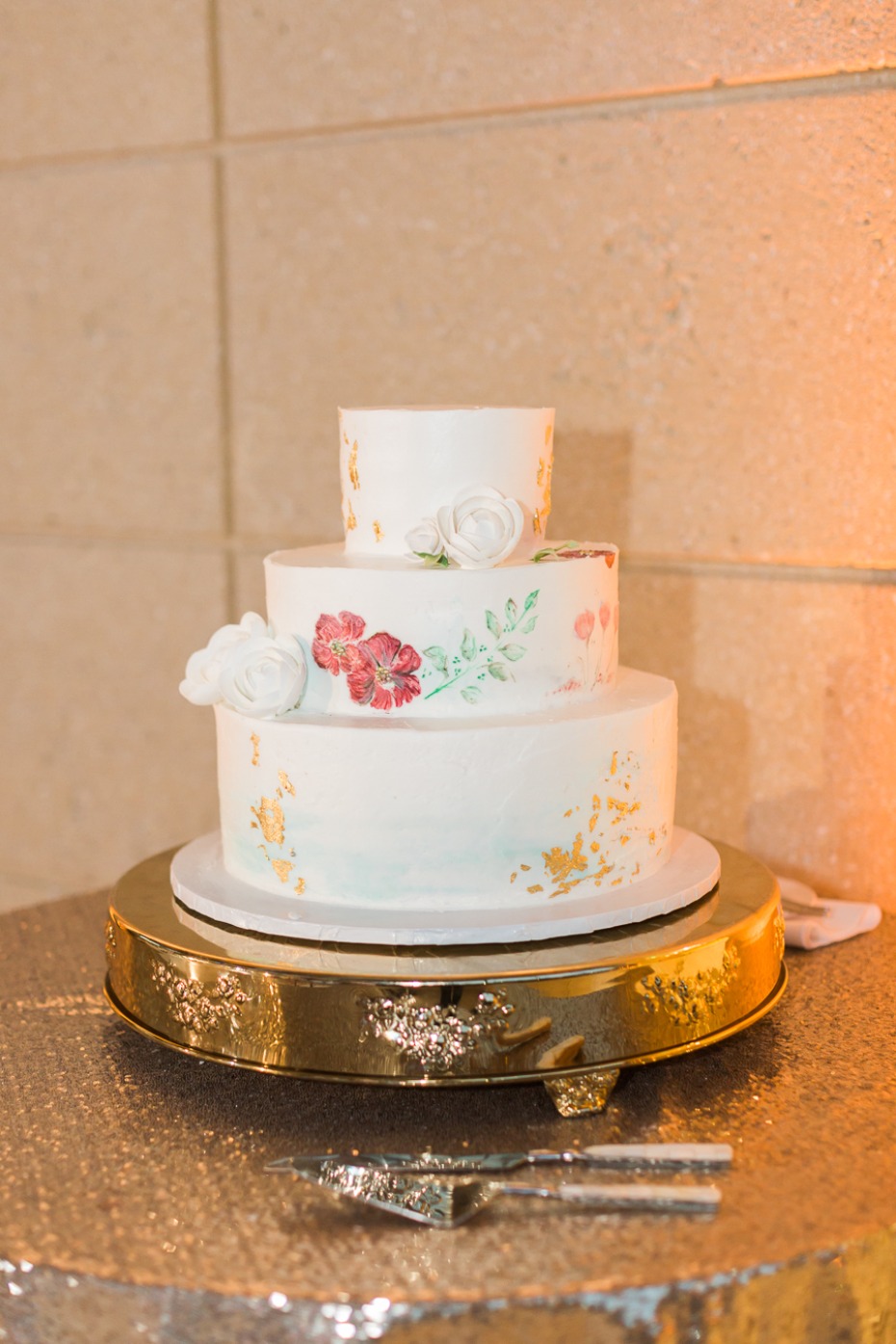 painted wedding cake with gold leaf accents