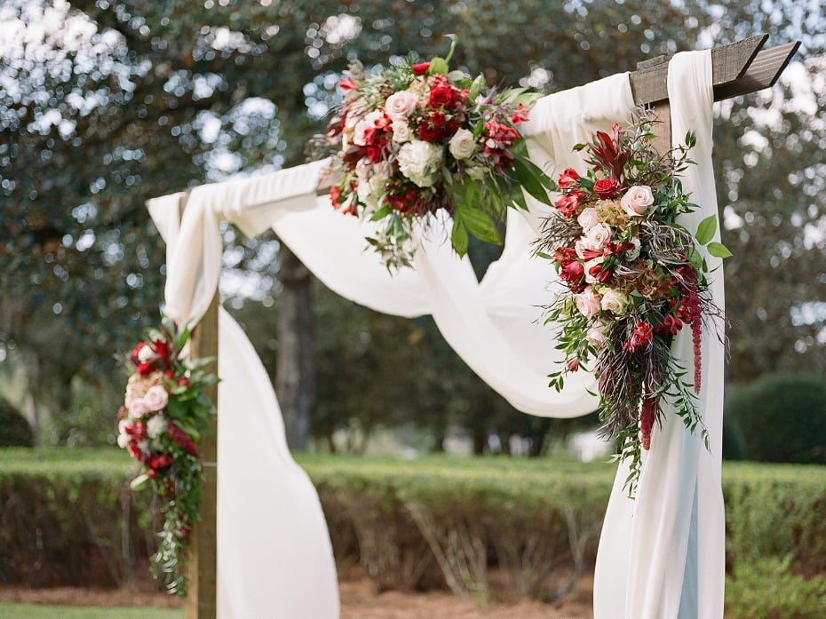 romantic floral accented wedding arch