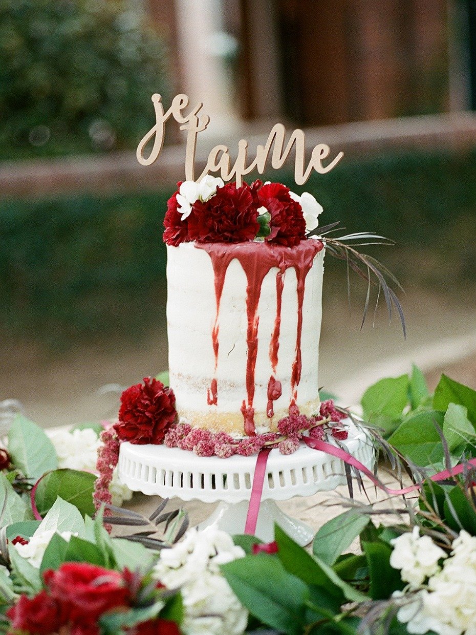 wedding cake with red drizzle