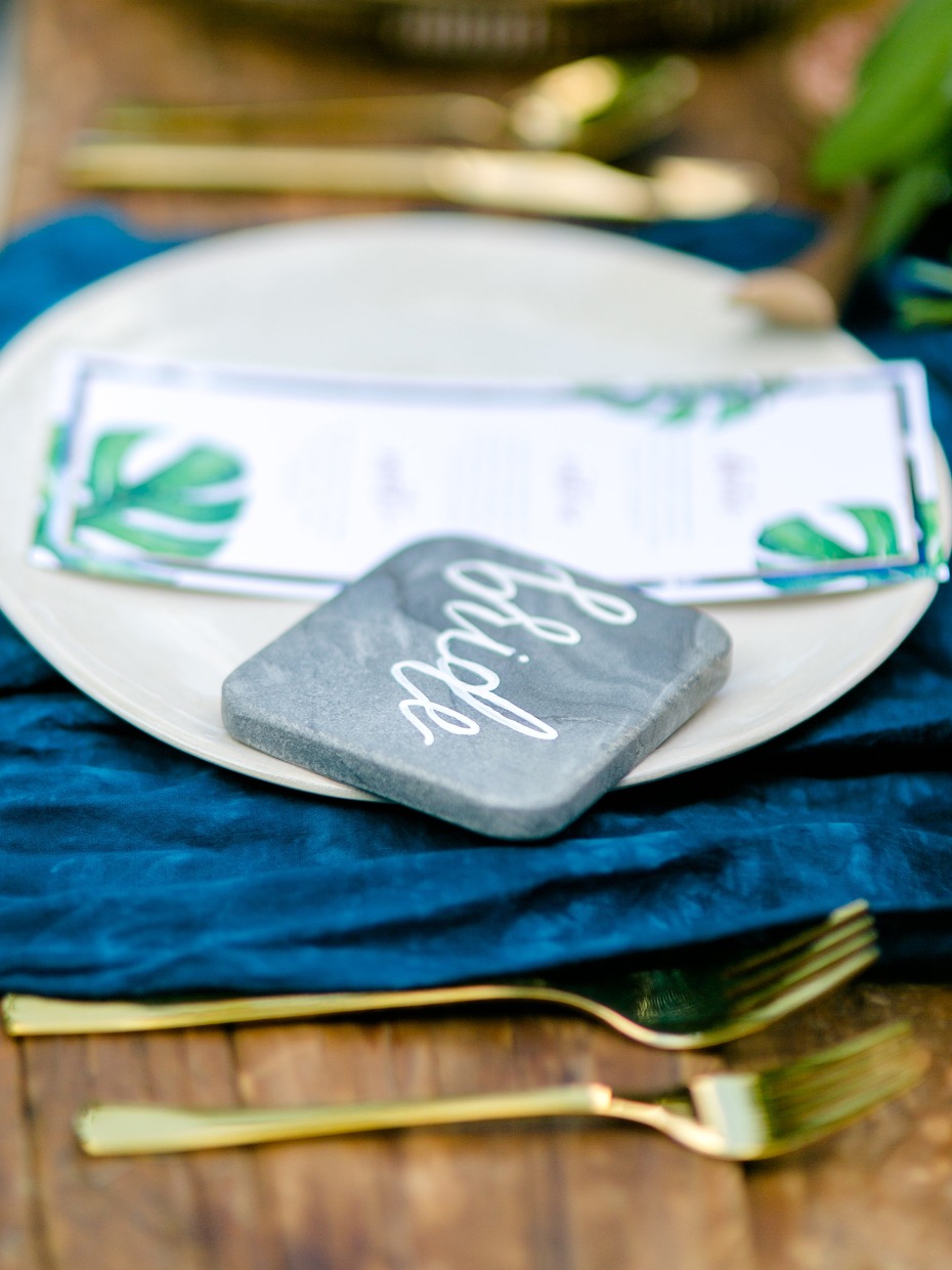 marble place card and gold flatware