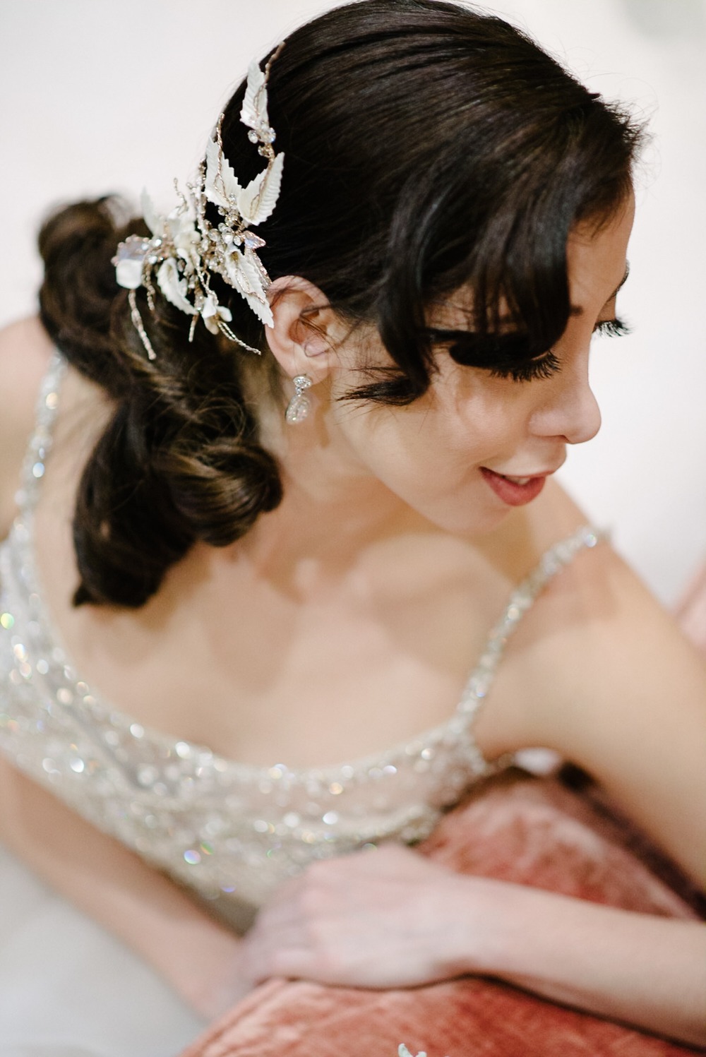 swooped back wedding hair and elegant hair piece