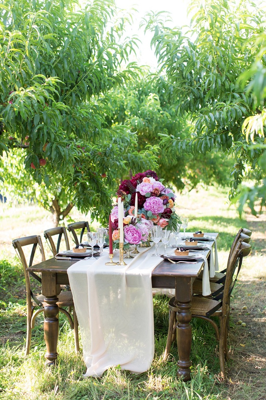 Beautiful outdoor table setting in a peaceful orchard