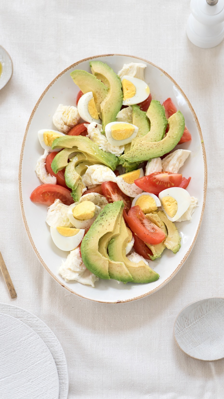 Delicious avocado, tomato, mozzarella, and egg salad