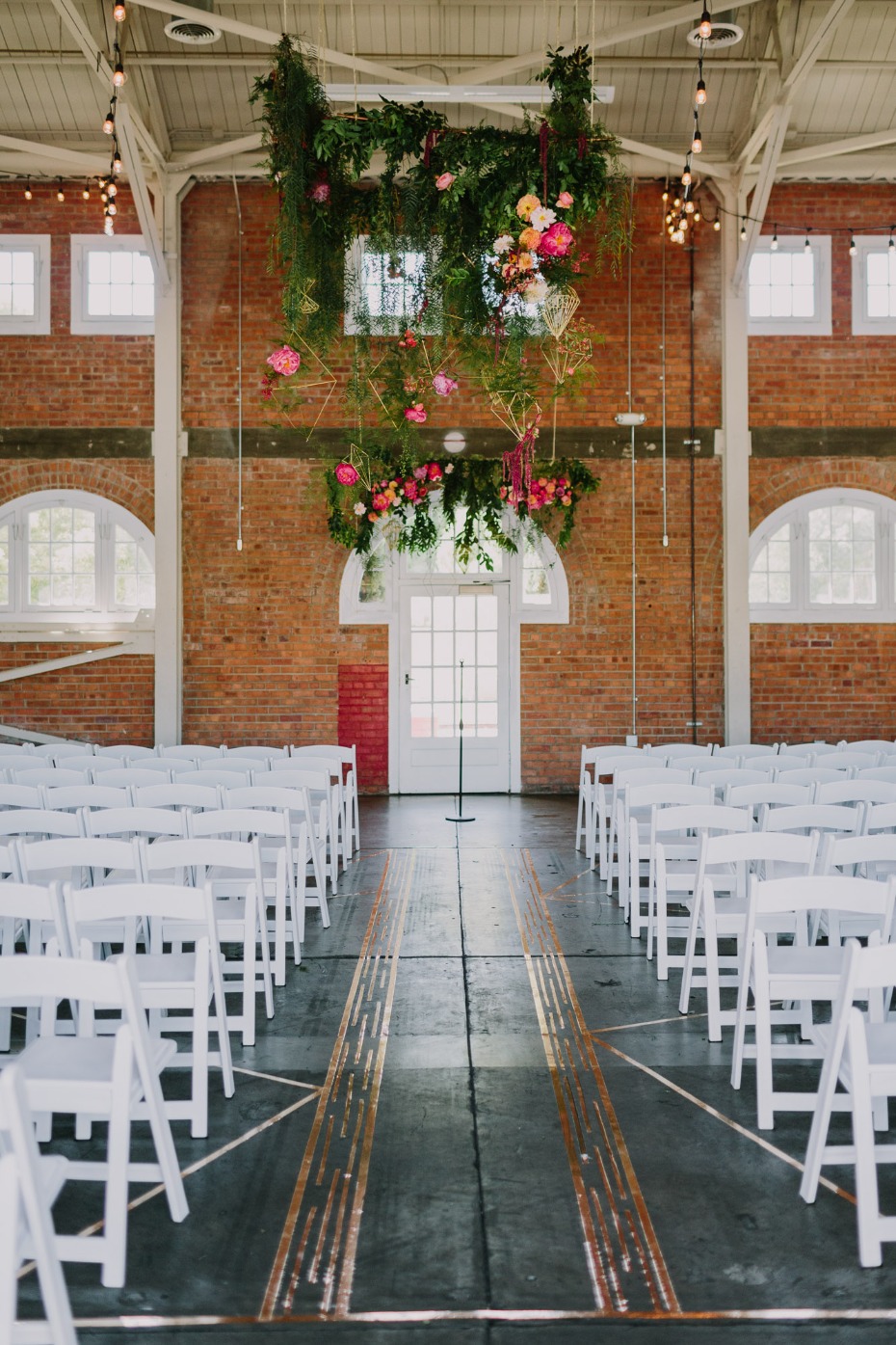 Open and airy ceremony space with greenery
