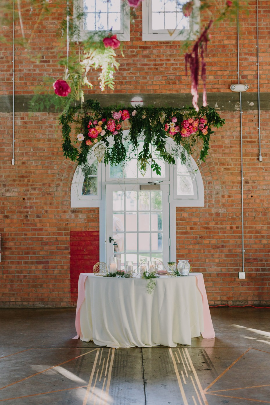 Love the flowers above this sweetheart table