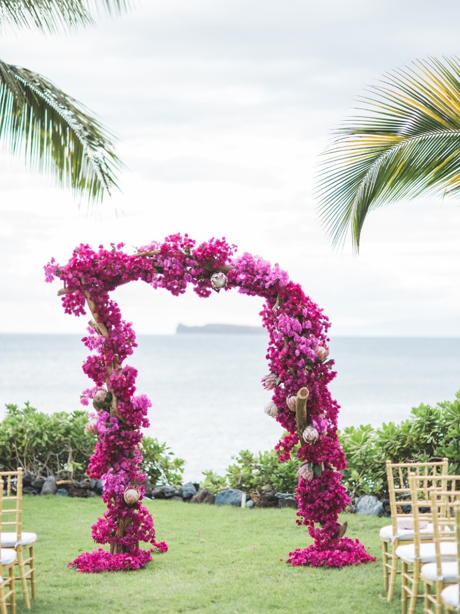 Stunning pink flower arch for ocean beach ceremony