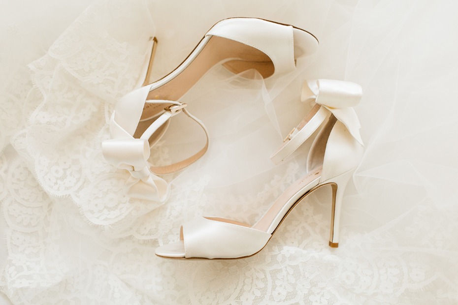 sweet all white wedding shoes with bows on the heels