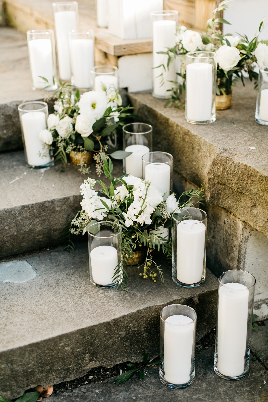 white flower and candle lined pathway