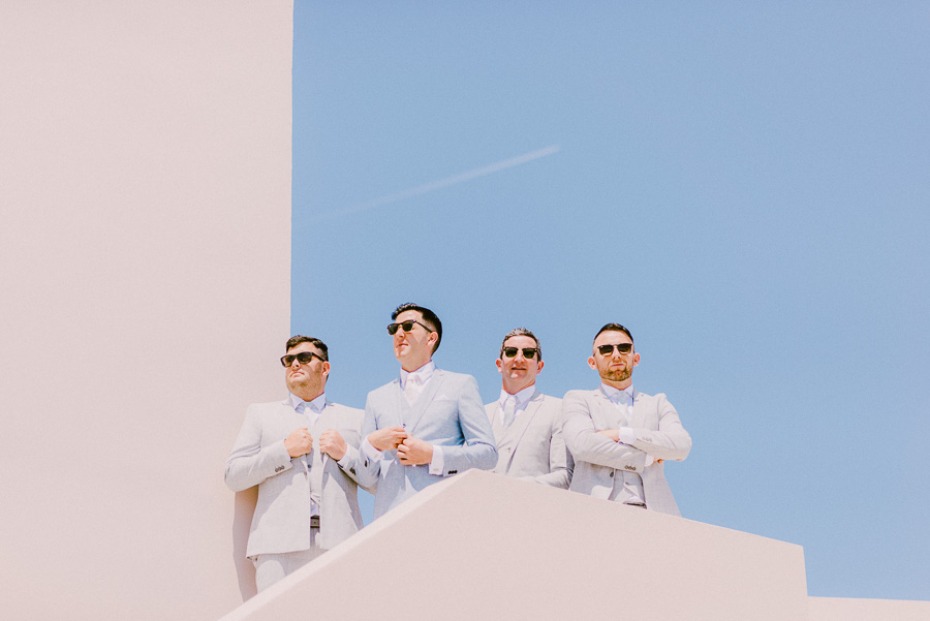 groom and his men in light blue and grey