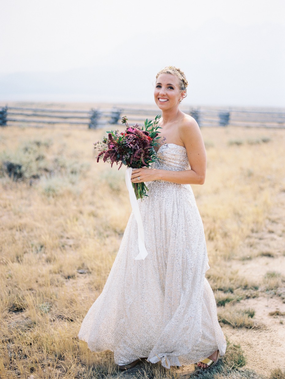 bride with wild flower burgundy bouquet