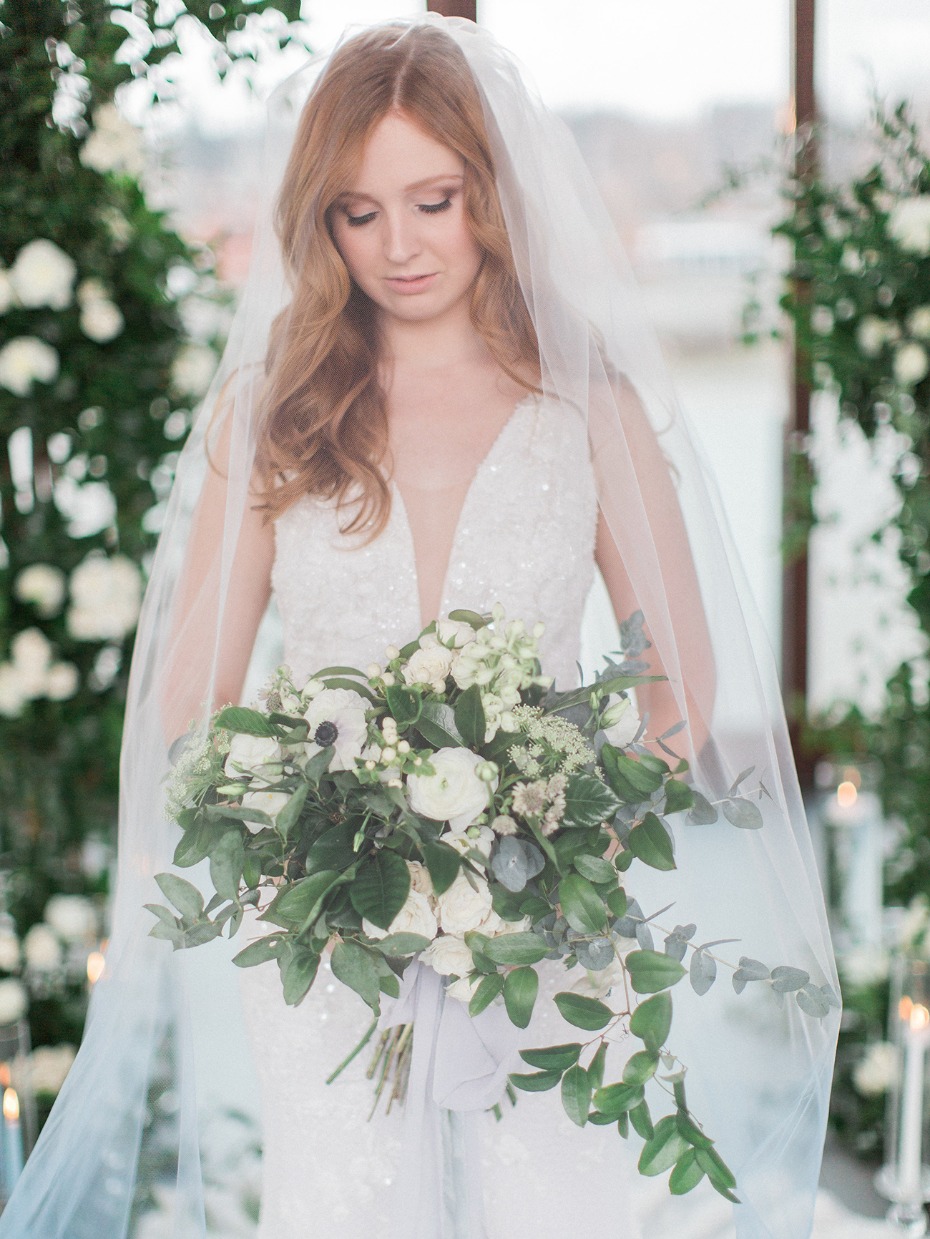 bride with soft blue ombre wedding veil