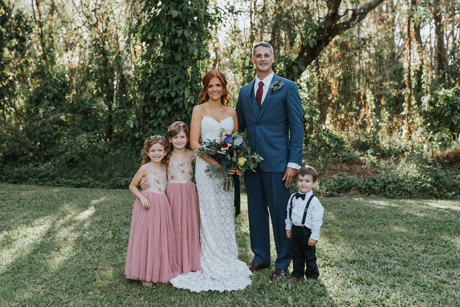 bride and groom with their flower girls and ring bearer