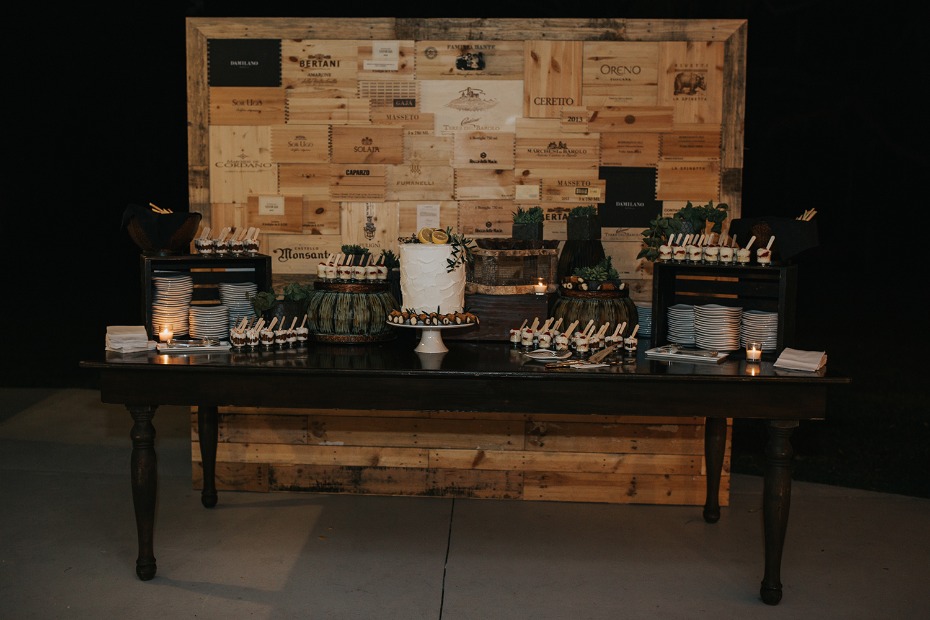 dessert table with wine box backdrop