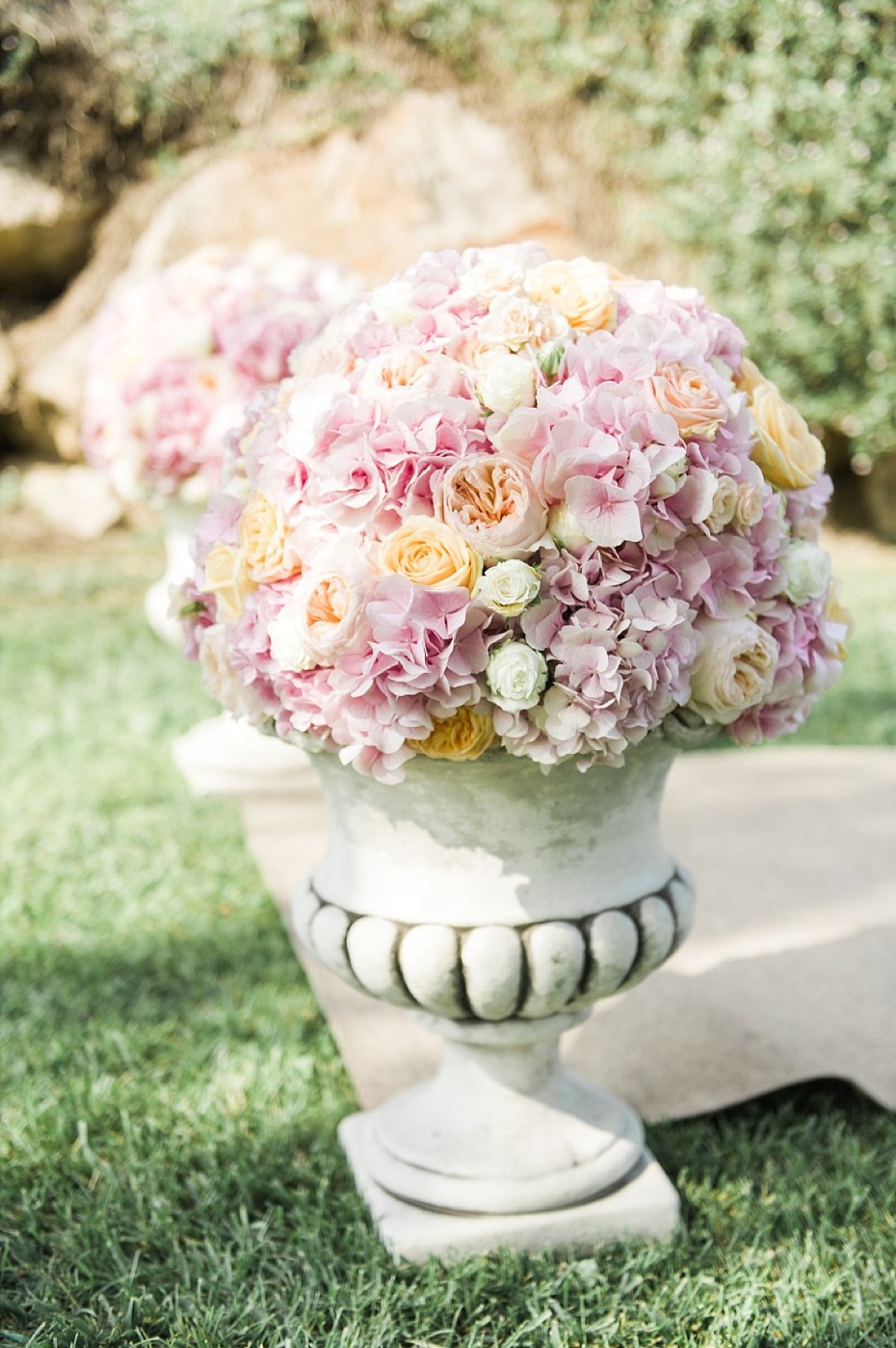 pink and peach potted floral arrangements