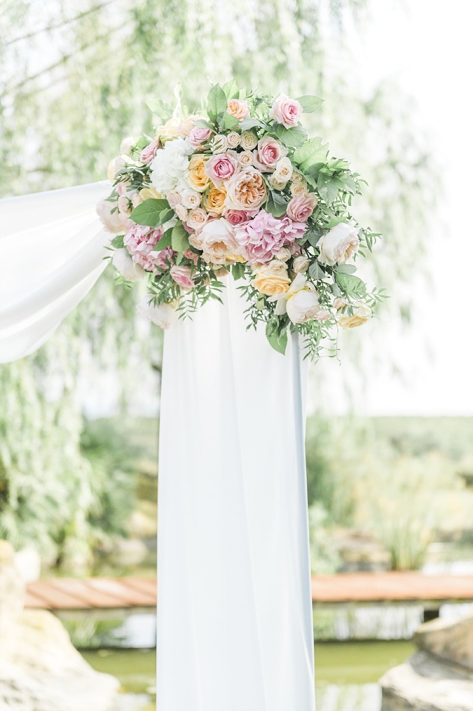 floral accented wedding arch