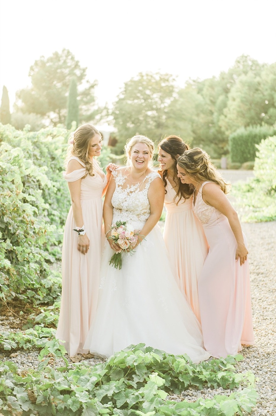 soft peach bridal party in golden sunlight