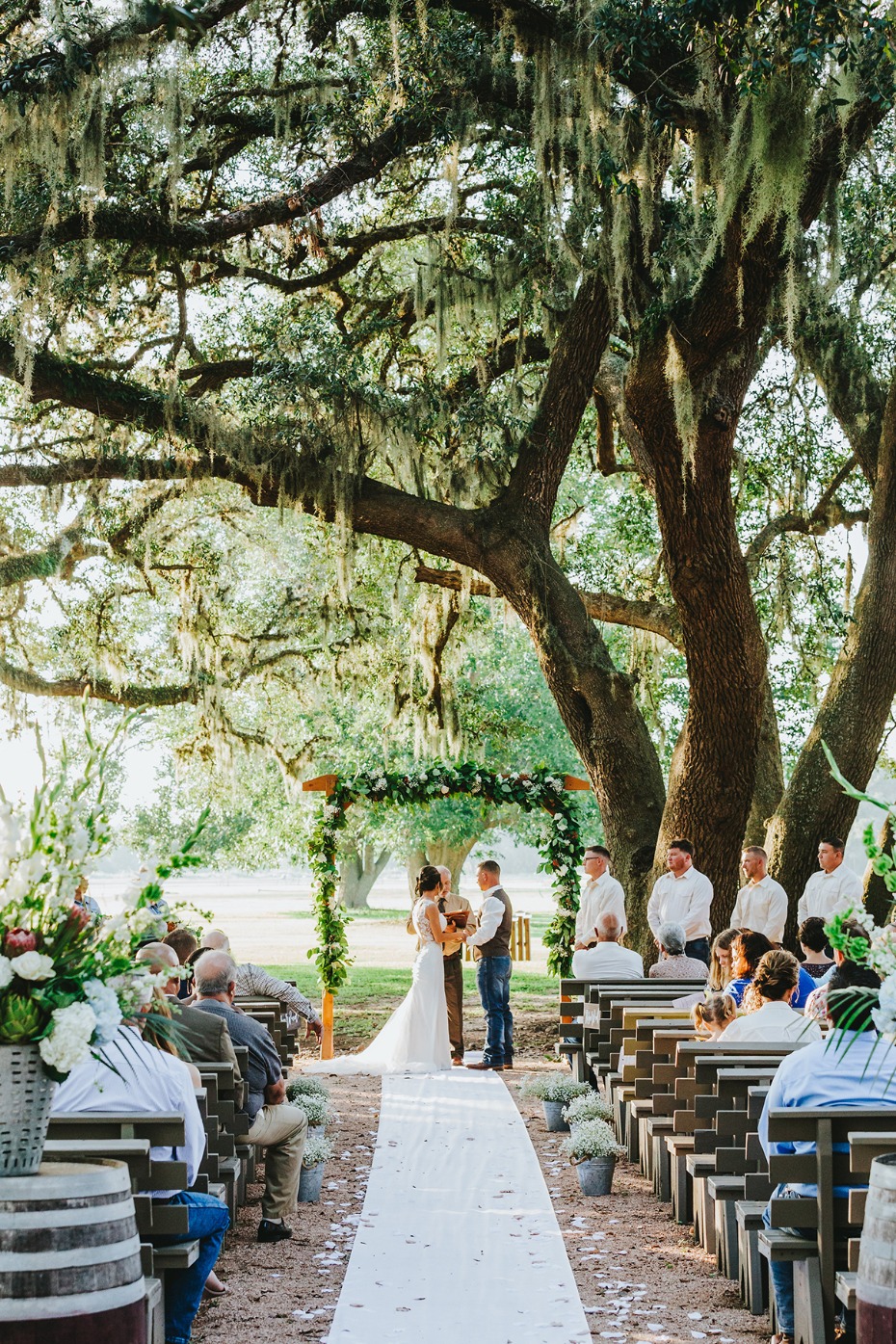 Romantic ceremony under old oak trees