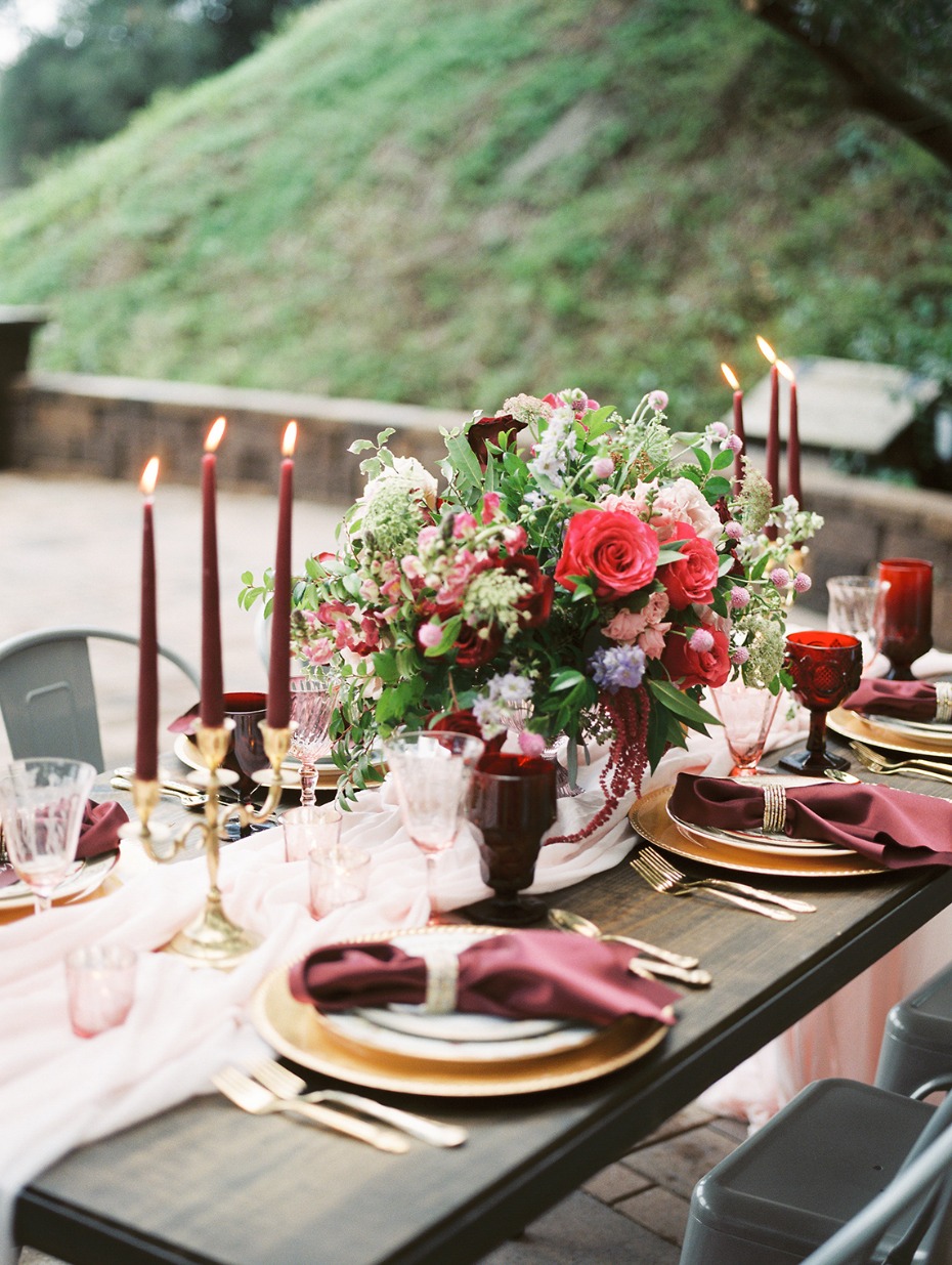 Romantic table setting in red, gold and blush