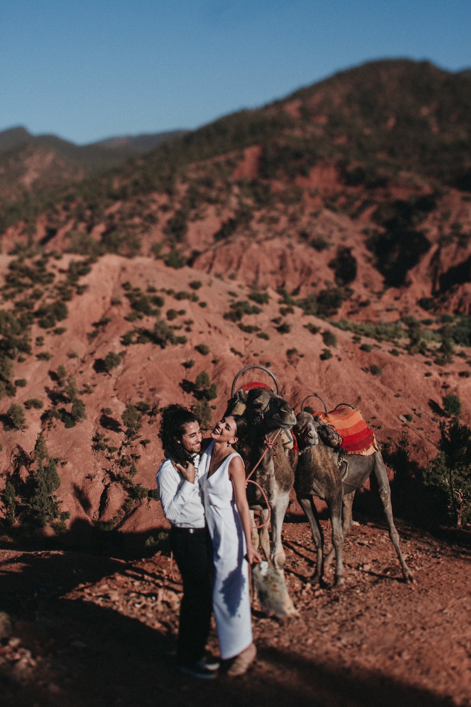bride and groom ride a camel at their Moroccan wedding
