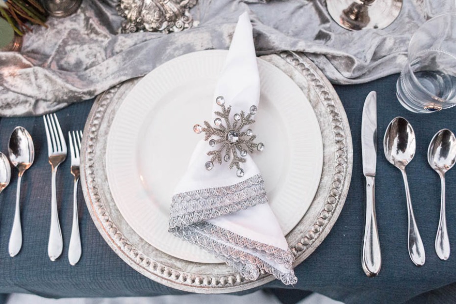 snowflake napkin holder and silver charger for your winter wedding table
