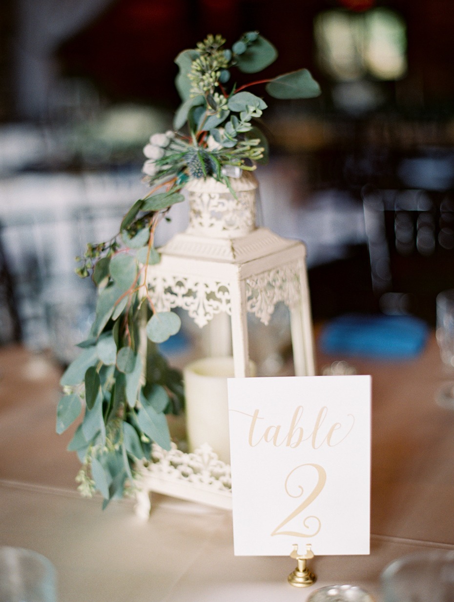 white lantern and table number centerpiece