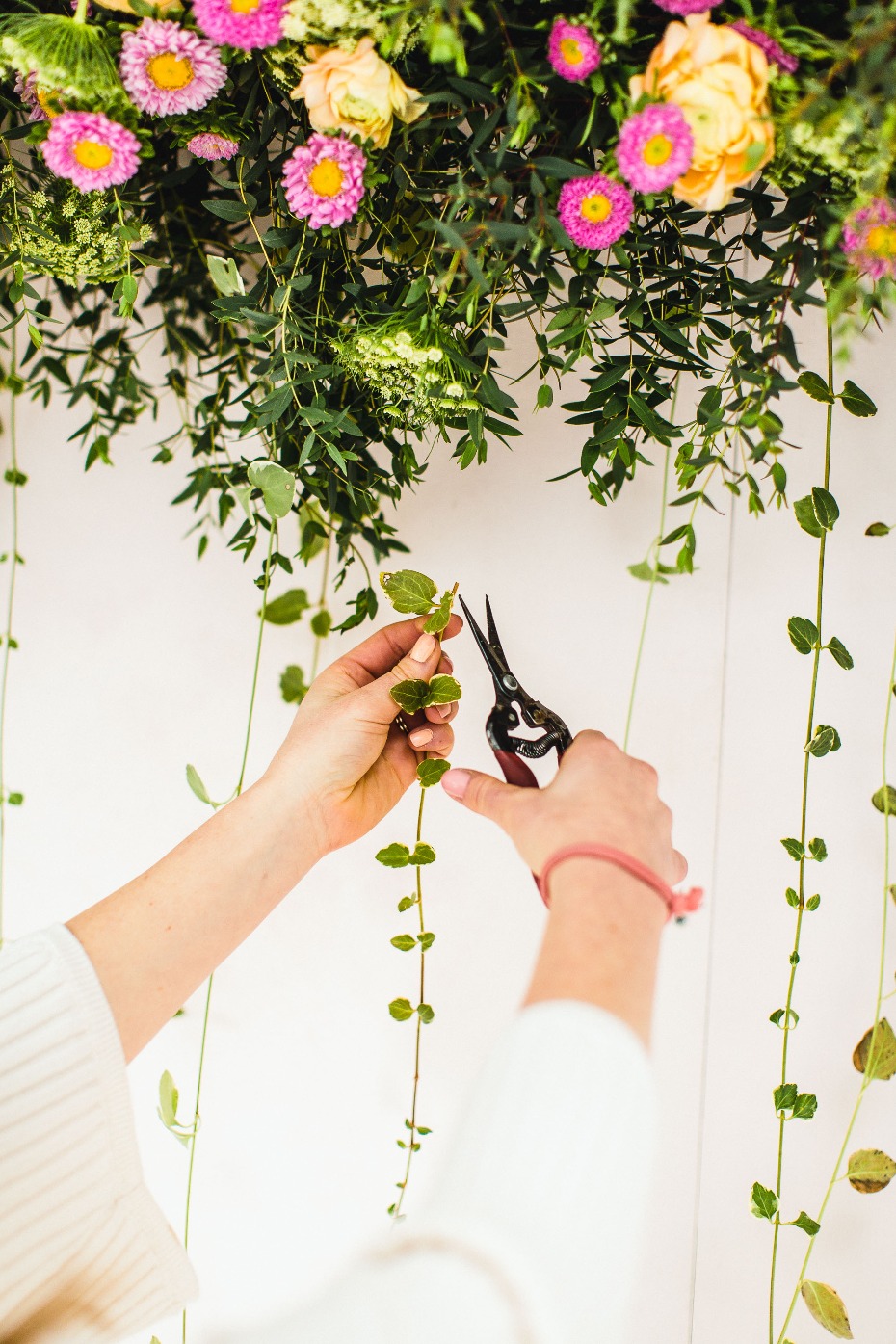 hanging ivy to add depth to our photo booth backdrop
