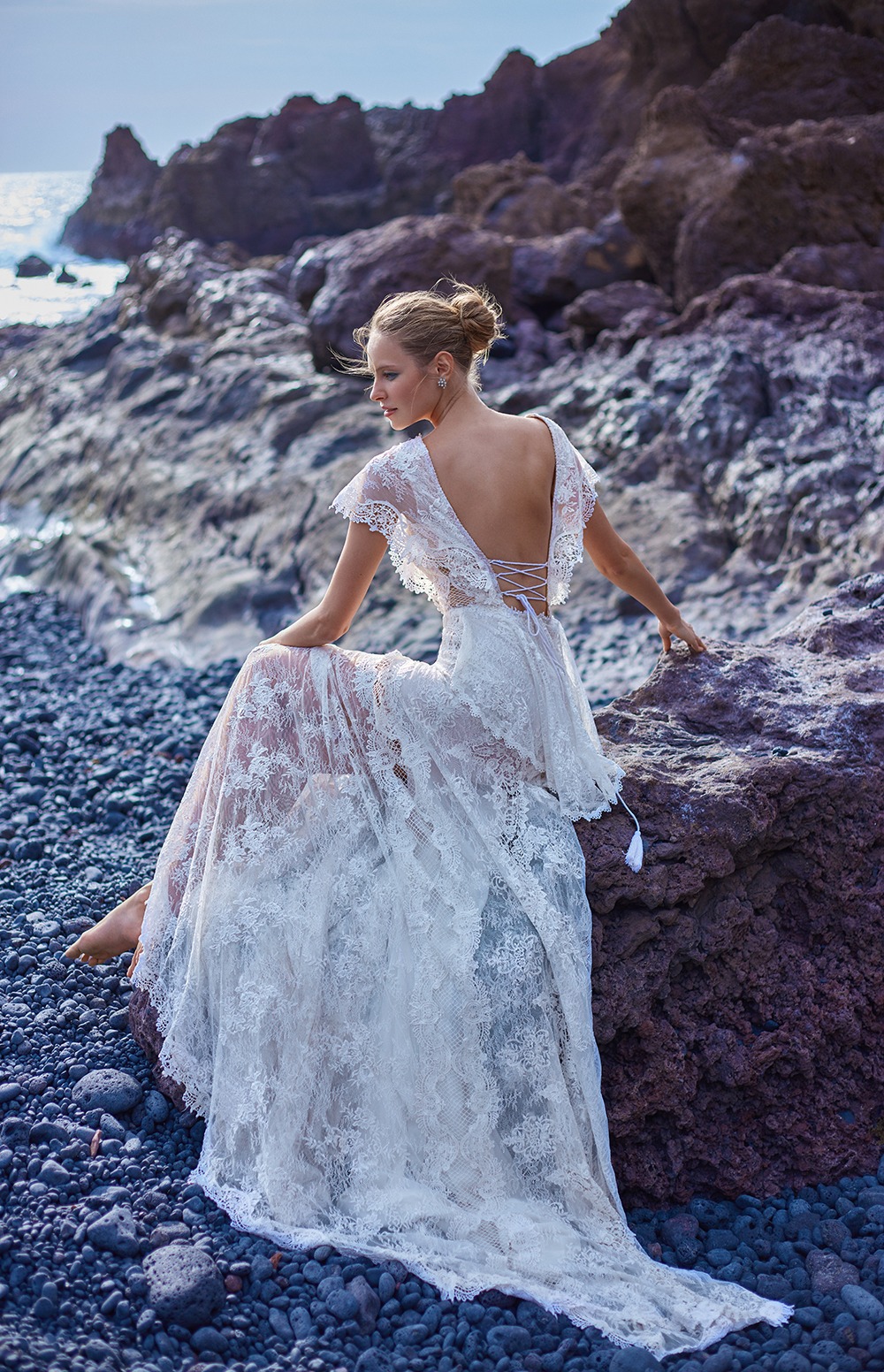 Stunning boho lace wedding dress by the sea