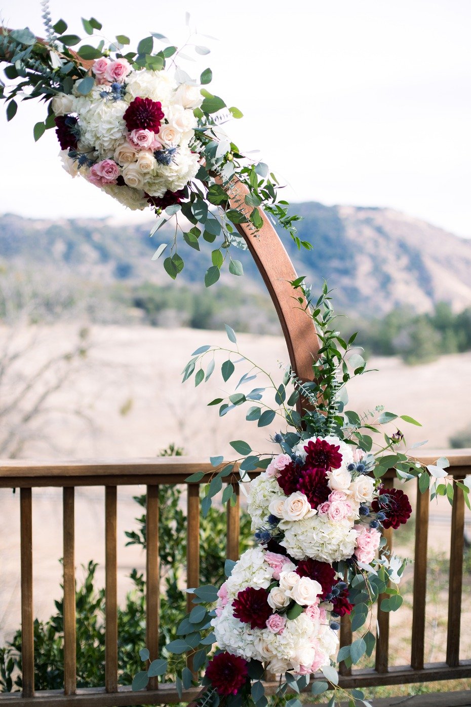 round wedding arch with floral accents