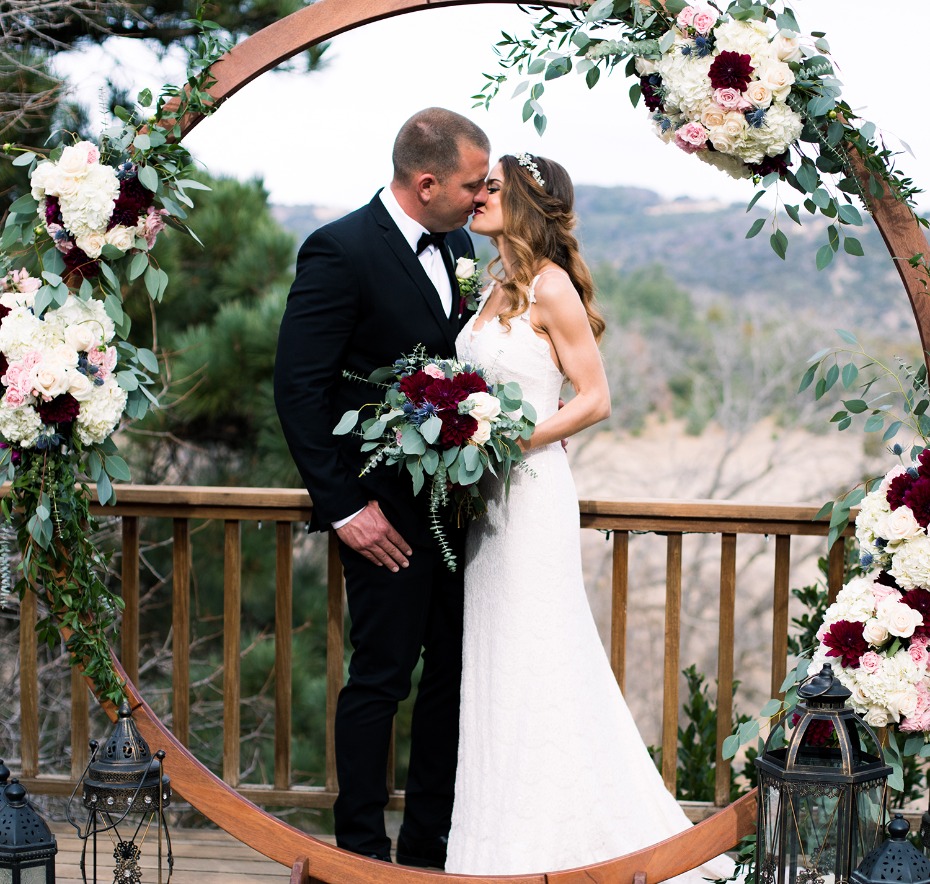 round wedding backdrop with floral accents