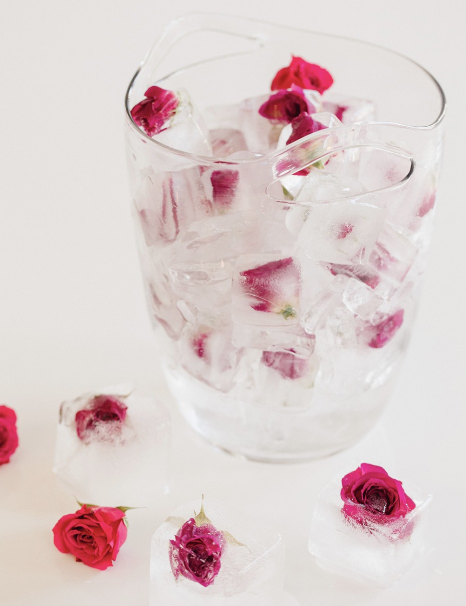 Glass ice bucket filled with dainty little roses