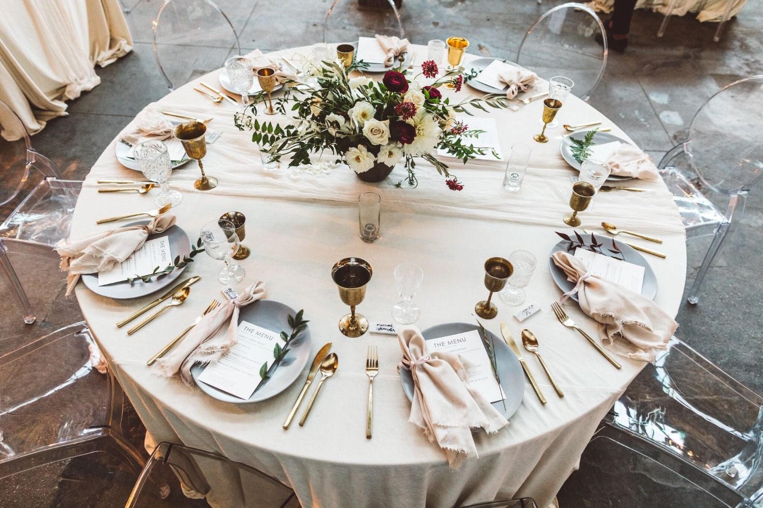 brass, baby blue and pops of red wedding reception decor