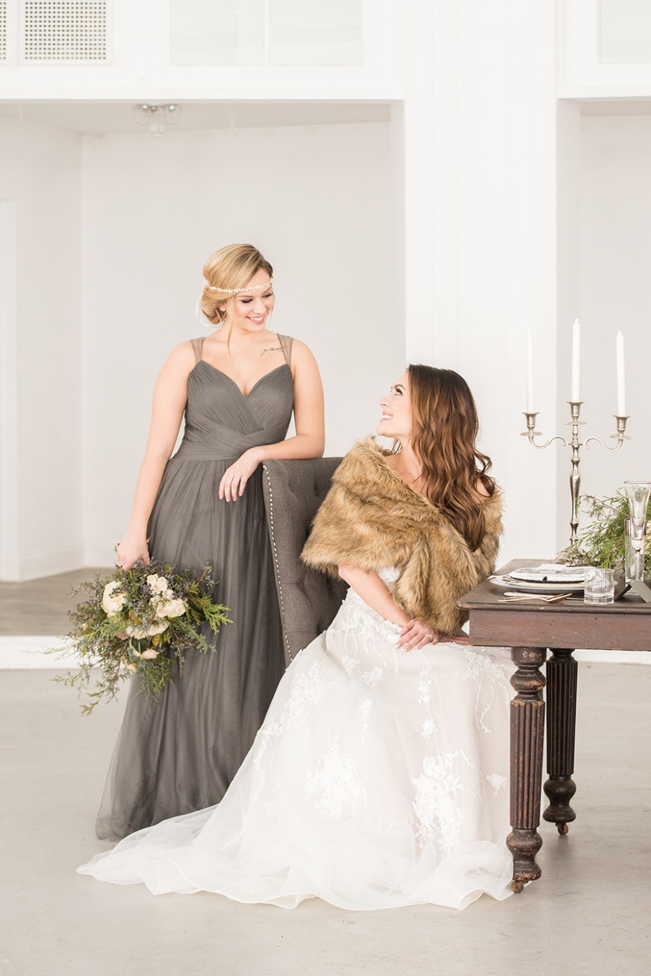 fur shall for the bride and elegant grey dress for the bridesmaid