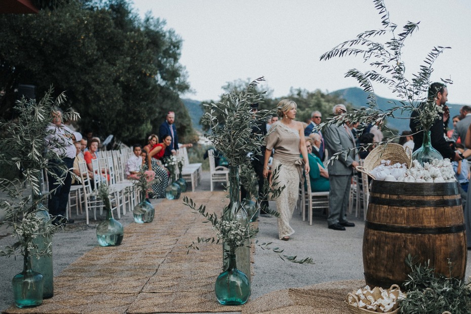 olive branch lined wedding aisle