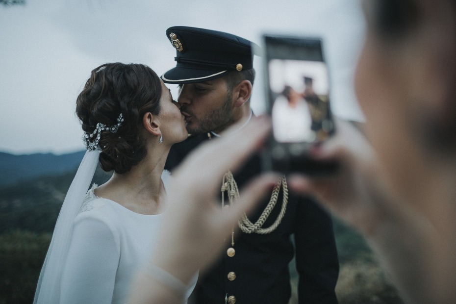 sweet wedding kiss captured via phone