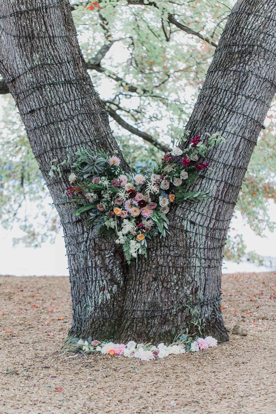 floral accented wedding tree backdrop