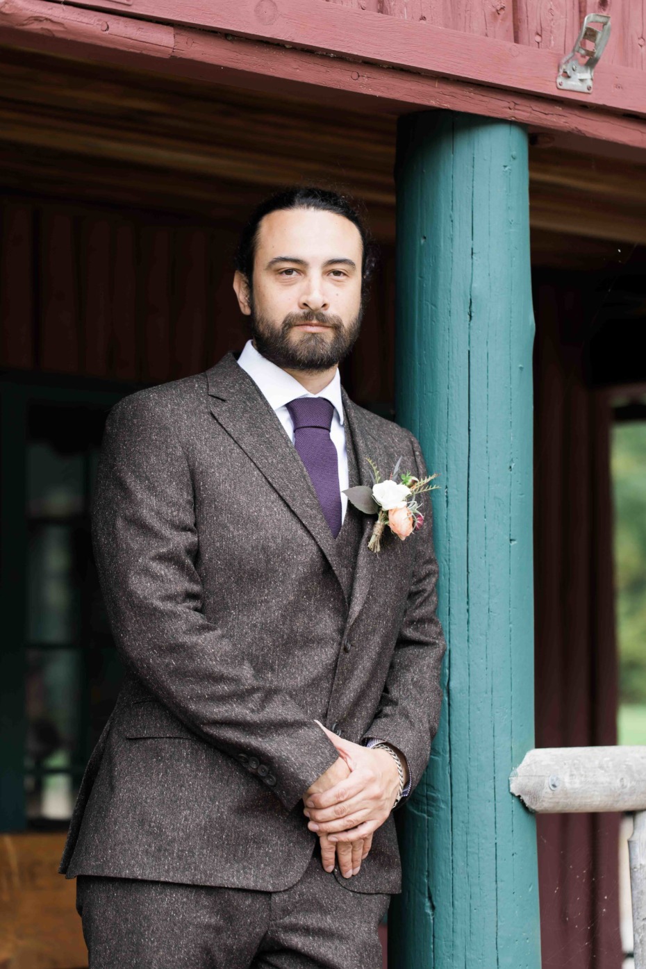 groom in tweed suit and purple tie