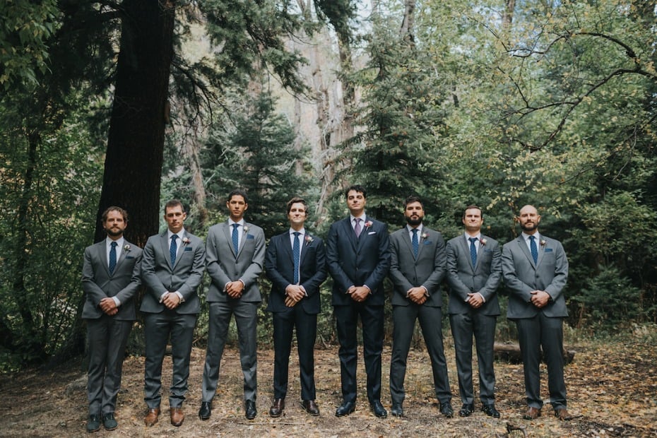 the groom and his men in varying shades of grey and blue
