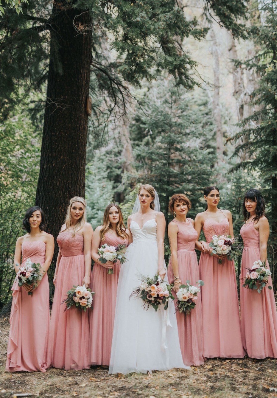 bride and her bridesmaids in matching pink