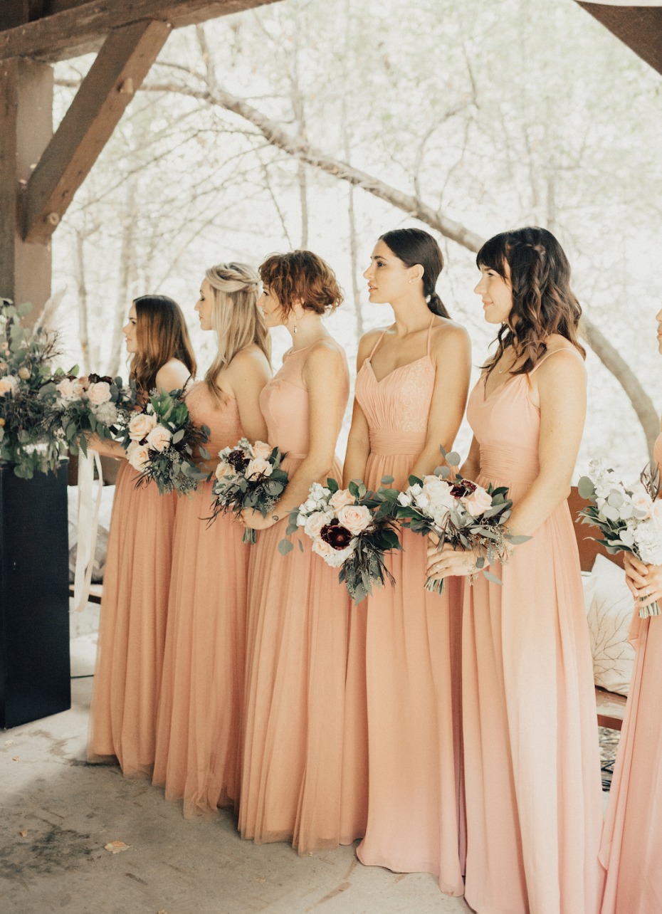 bridesmaids in matching pink dresses